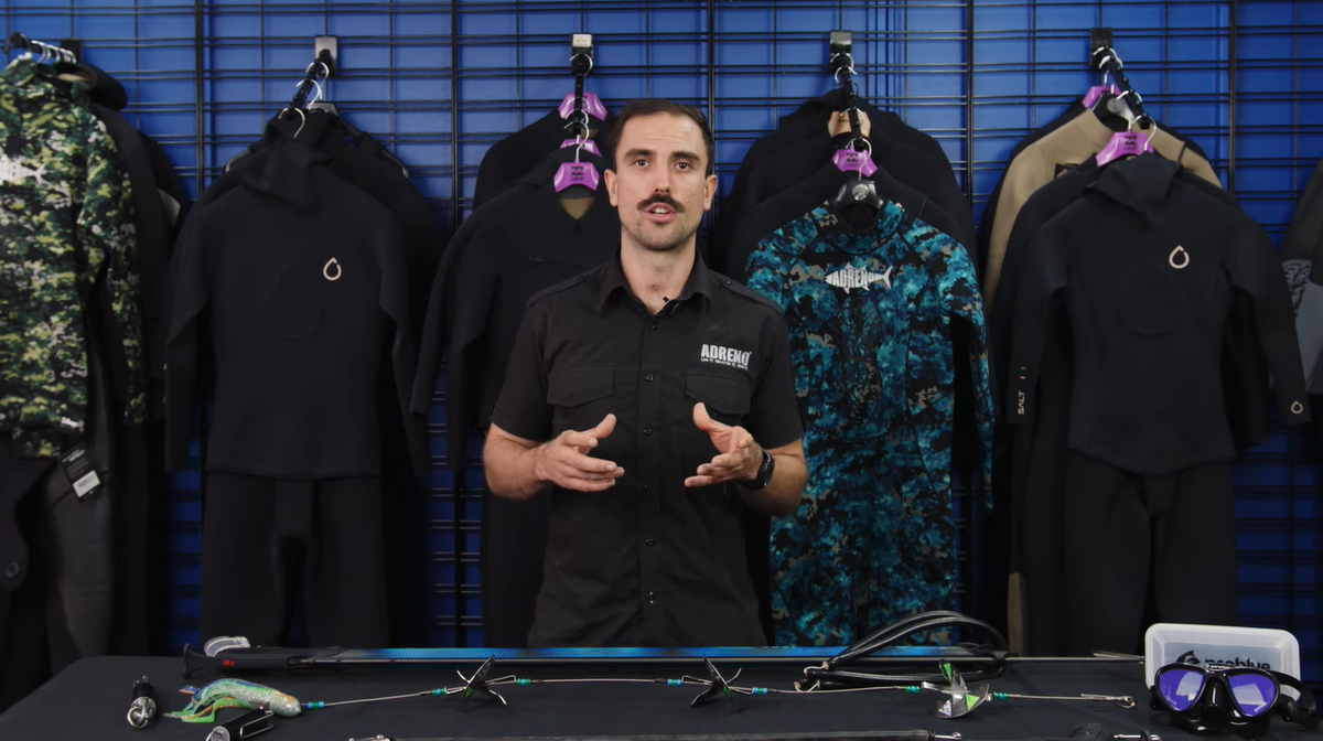Speaker talks about how to deal with dangerous animals at sea when spearfishing.